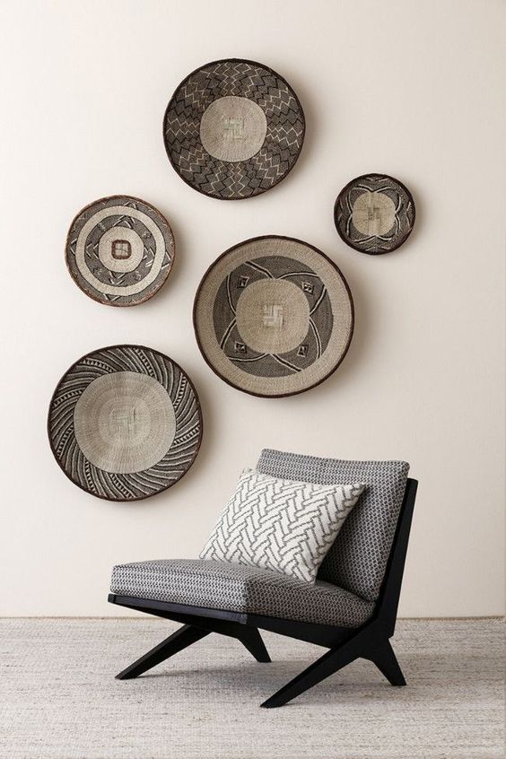 24 African bowls diplayed on the wall as a bold decor feature