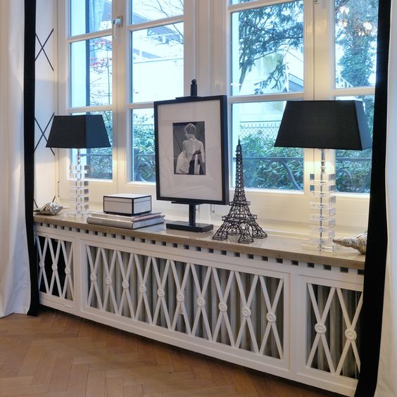 decorated radiator screen attached to the window sill