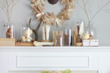 24 feather wreath, pumpkins in cloches and vintage statuettes