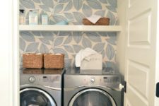 24 light patterned wallpaper accentuates the laundry and doesn’t make it look small