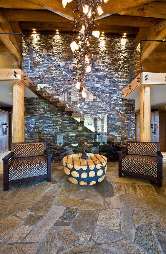 rough stone floor adds to the warm rustic cabin look of the entryway