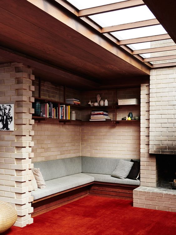 red carpet floors for a reading nook by the fireplace