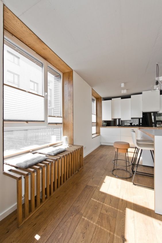 rustic wooden screen attached to the window sill to enlarge it