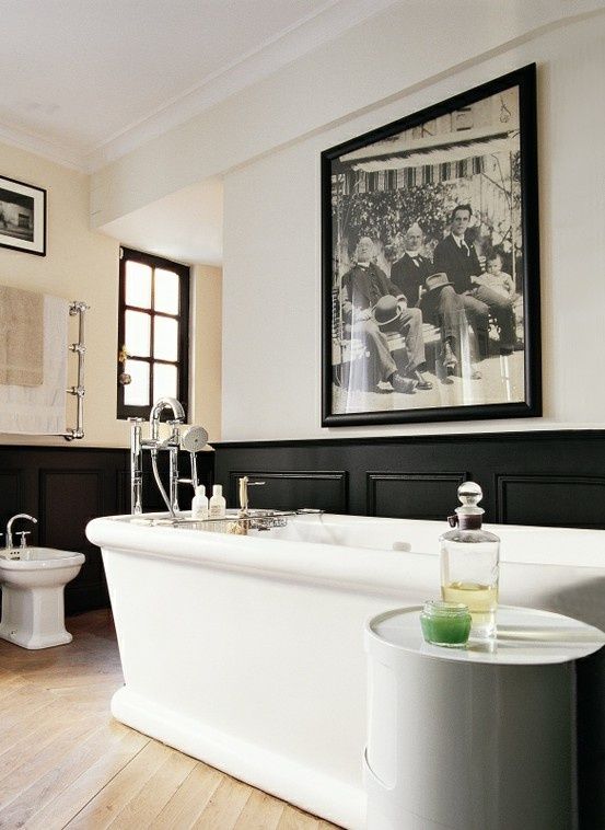 art deco masculine bathroom with black wainscot