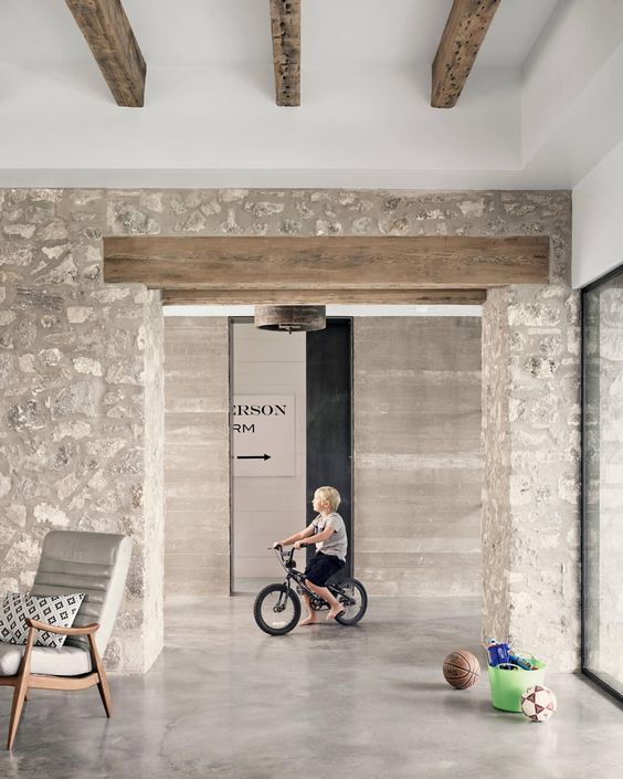 stone accent wall in the entryway of a farmhouse