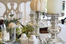 31 silver candle holders and pumpkin stands, woven chargers and white porcelain