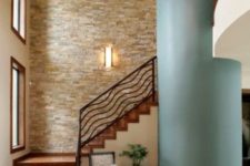 31 stacked stone wall in the hallway with a sea-inspired pillar