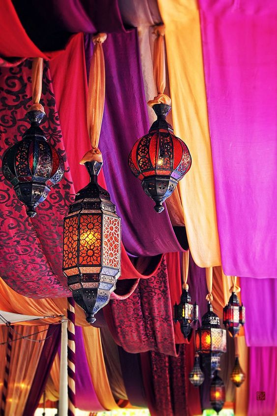 Moroccan drapes and lanterns hung with fabric