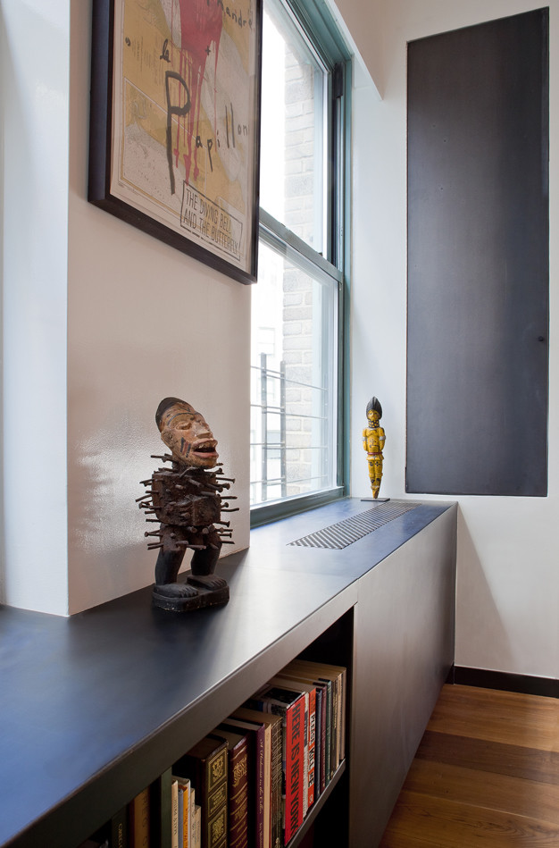 turn a wall into a bookcase and hide a radiator in it (Eisner Design LLC)