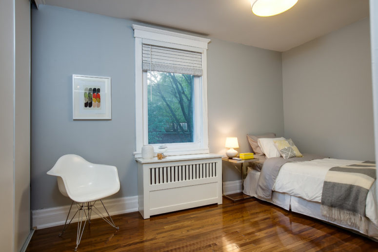 a simple radiator cover in a bedroom that makes a window sill's surface larger (The Graces - ReMax Hallmark Realty)