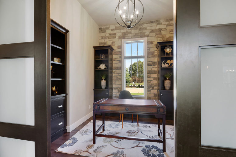 A stone accent wall also works in home offices. (TCD Homes)