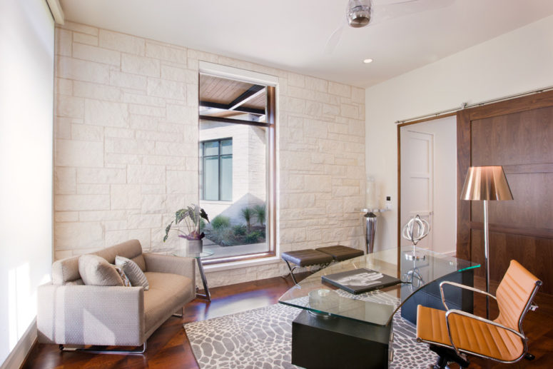 A stone accent wall could be in contrast with other walls or it could continue their color scheme. (LaRue Architects)