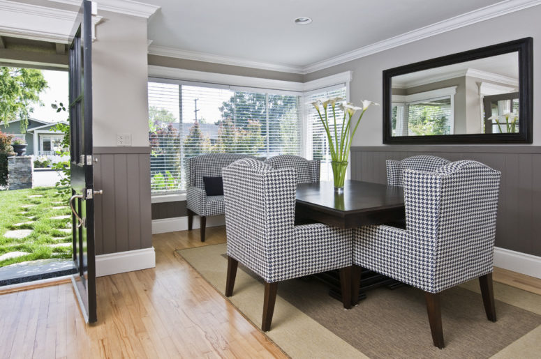 grey dining room with wainscoting