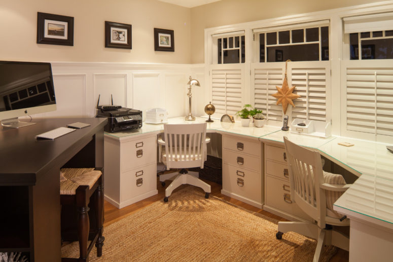 White wainscoting, window treatments and shutters create lots of dimension in this simple office space. (Reid Developments Ltd)