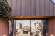 01 This modern cedar-clad home reminds of an English country house with a gabled roof