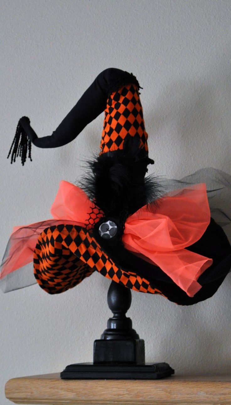 bold orange and black witch hat display is a simple yet cool decoration that matches many parties