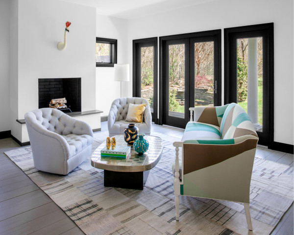 modern living room Gold and turquoise touches refresh the decor, and a simple rug adds coziness