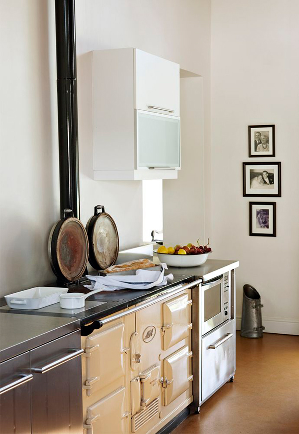 Most of furniture and some appliances are vintage here, and exposed beams and pendant lamps add industrial touches Most of furniture and some appliances are vintage here, and exposed beams and pendant lamps add industrial touches