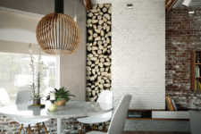 04 Firewood stacked in the wall makes the dining area cozier