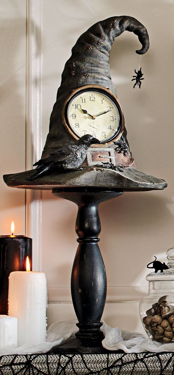 count down the minutes to the witching hour with this imaginative witch hat pedestal (perfect for rustic Halloween arrangements)