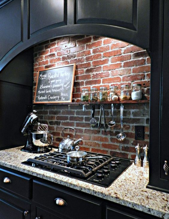 red brick over the cooker to save the wall from dirt and fat