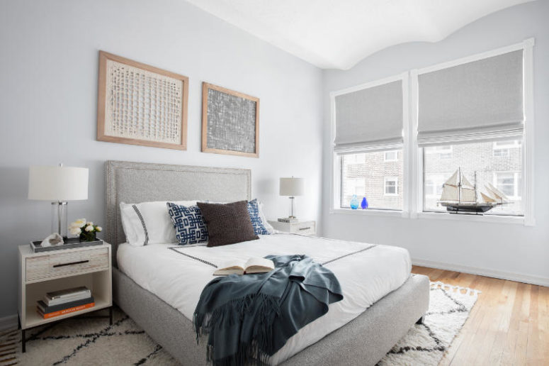 calm bedroom design The bedroom is no less calm than the living room, there's an upholstered bed, a textural wall art and some cozy fabrics