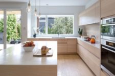 06 The countertops are white and the space looks totally uncluttered, sleek and modern