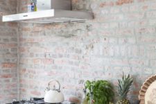 06 antique whitewashed brick wall contrasts with modern kitchen design