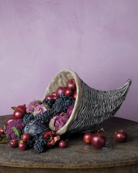 small cornucopia with apples, grapes, persimmons, pomegranates
