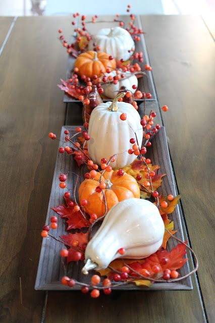 dishes with faux pumpkins, leaves and berries are a simple last minute Thanksgiving idea