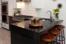 08 a sleek look effect is provided with a black quartz waterfall countertop, which is durable