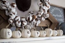 08 simple mantel decor with white faux pumpkins and a cotton wreath