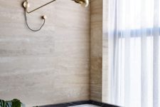 09 Stone and marble of various shades make this bathroom cool and refined