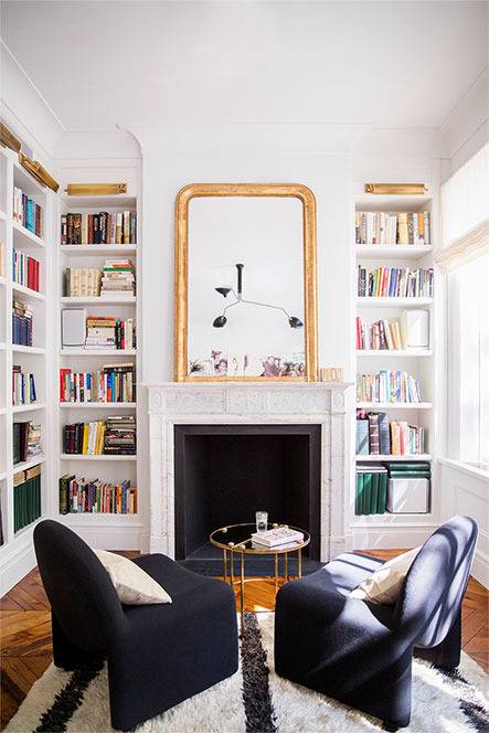 The reading nook boasts of a library, a non-working fireplace and a couple of comfy chairs