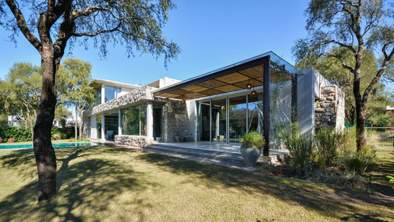 a mediation area shares a visual connection with the pool and the surrounding trees