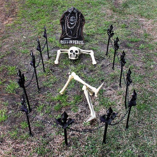 set up a skeleton head, arms, and legs as if he's relaxing on his final resting spot