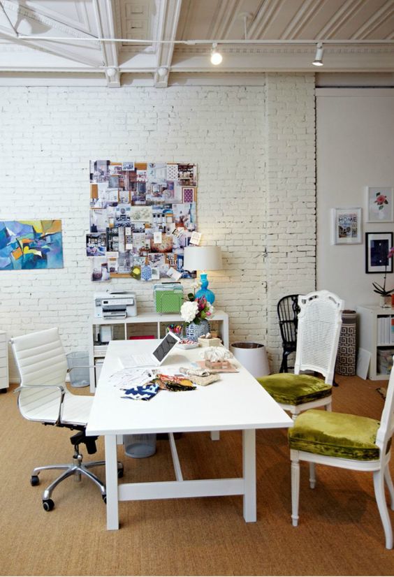 whitewashed brick is a perfect backdrop for a modern creative home office