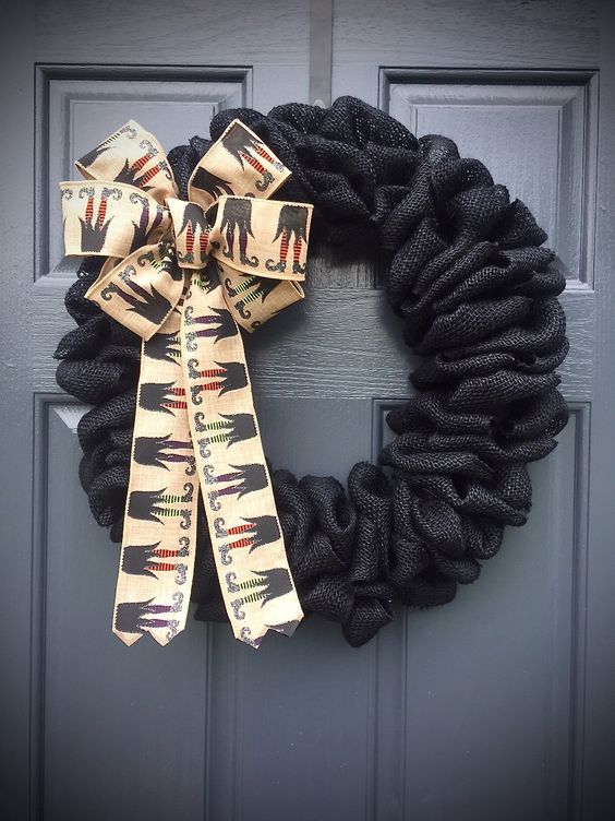 black burlap wreath with wiches' legs ribbon