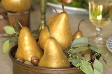 10 gold pear and acorns centerpiece in a bowl