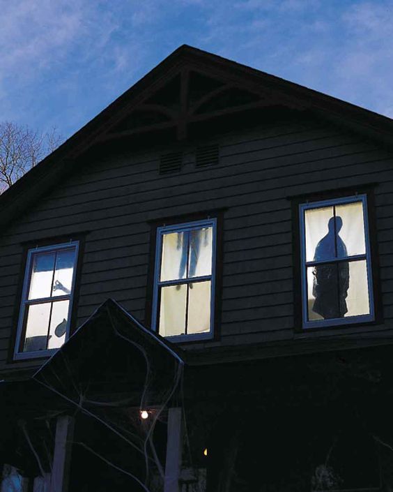 these really spooky silhouette curtains will add to your outdoor Halloween decor