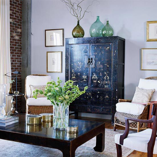 antique Chinese cabinet and coffee table pop up in a light grey backdrop with their yellow details