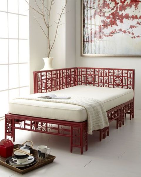 Chinese inspired red and wwhite daybed in a neutral space
