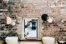12 exposed brick wall with mirrors on it