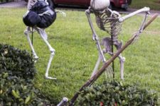 12 skeletons hiding bodies in the yard is a humorous and cool idea for a scene