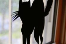 13 you can easily make and attach black paper silhouettes to windows