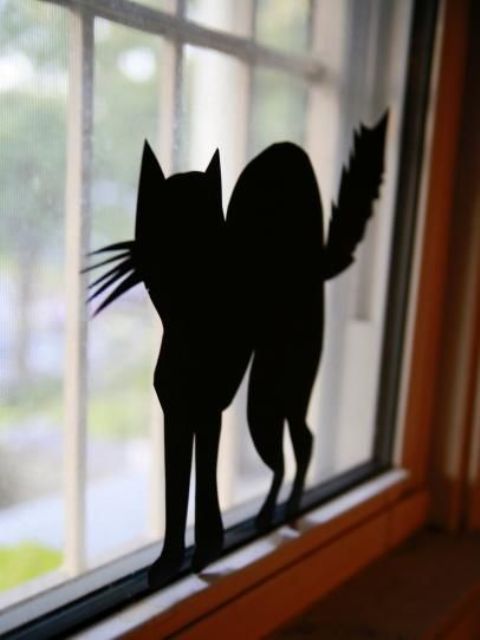 you can easily make and attach black paper silhouettes to windows