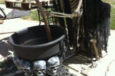 15 skeleton stirring something in a cauldron can be placed at your front porch or in the backyard