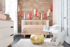 16 a little one’s nursery is given extra character when focused on the exposed brick wall