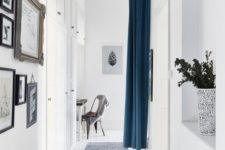 17 this blue curtain is used instead of a door to separate the dining room from the hallway