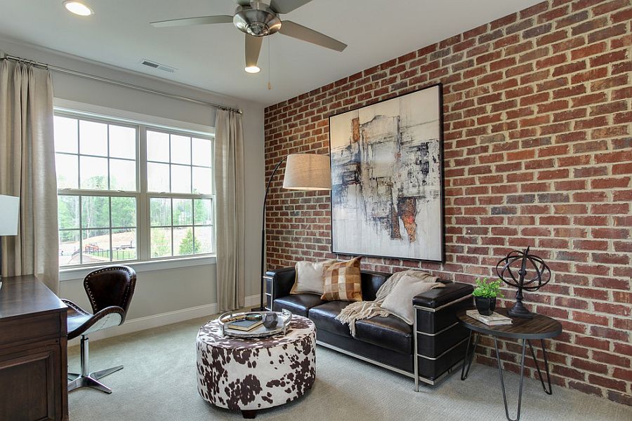 modern home office with an aacent brick wall and a wall art